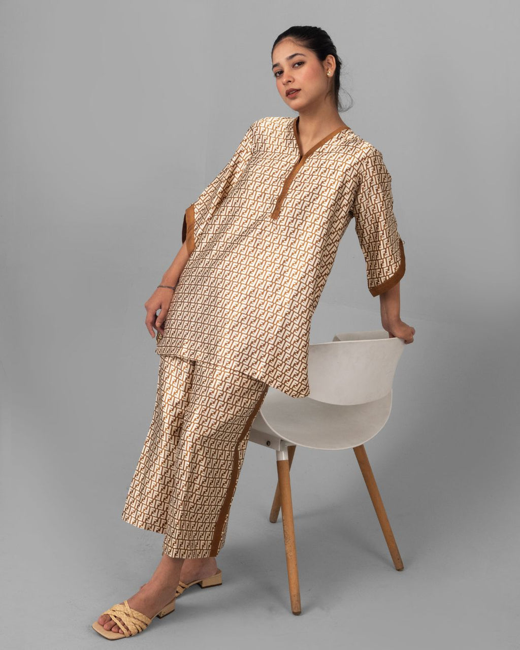 Printed silk-shamooze top with copper V-neck trim - ELYRA
