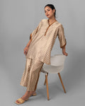 Printed silk-shamooze top with copper V-neck trim - ELYRA